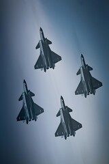 Military aircraft perform thrilling jet maneuvers in China's skies showcasing dynamic action and...