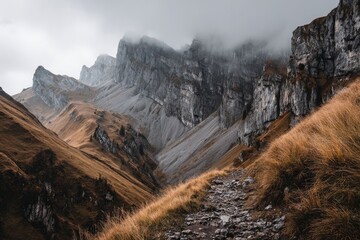 Mountain pass with rocky peaks and a trail