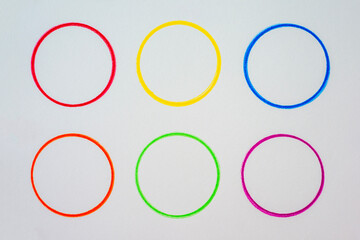 Colorful Circular Outlines on White Canvas