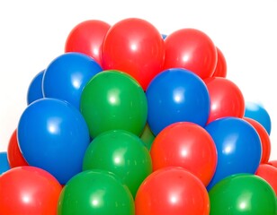 Fototapeta premium Colorful balloons piled in a pyramid shape against white background