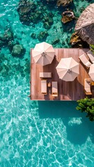 Exclusive floating beach club deck oasis with sunshades and turquoise sea view