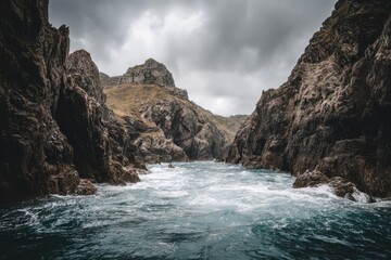 Rocky cove, rough water, dramatic sky