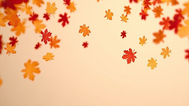 Falling autumn leaves on a light peach background