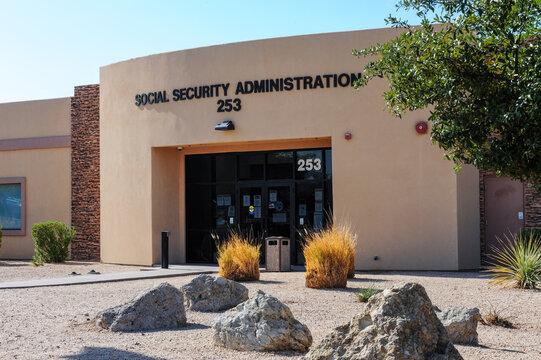 Social Security Administration office with front entrance, labeled signage, desert landscaping, and accessibility features, representing a federal facility providing public benefits and social service
