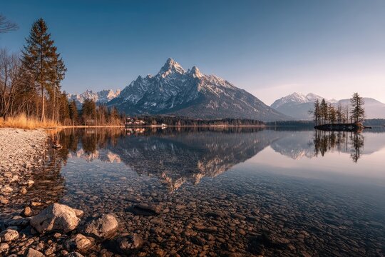 Mountain reflection on a tranquil lake, clear water, snow-capped peak, serene autumnal scene