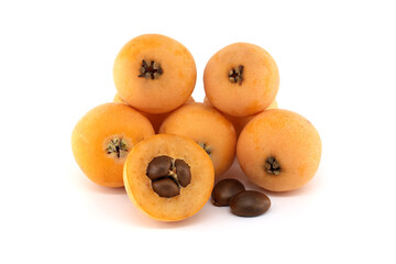 Loquat fruits and seeds showing pulp and peel isolated on white background