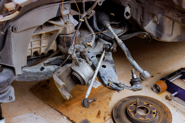 Car suspension components tools displayed in garage during vehicle repair process