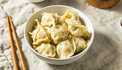 Steaming Hot Dumplings in a Bowl, Delightful Asian Dumplings Ready to be Savored with Chopsticks