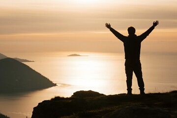 Man silhouette arms raised mountain top success freedom achievement travel adventure view