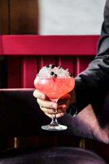 Enjoy a Refreshing Cocktail Featuring Fresh Berries That is Served
