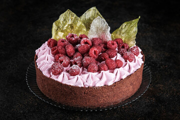 Savor the Delicious Raspberry Cake adorned with Beautiful Decorative Leaves