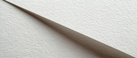 Close-up view of textured white paper sheets overlapping at an angle