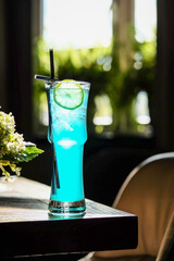 A Refreshing Blue Cocktail elegantly presented in a beautiful glass