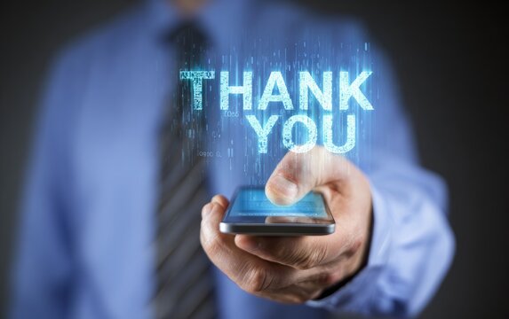 Businessman holding phone with "Thank You" projected