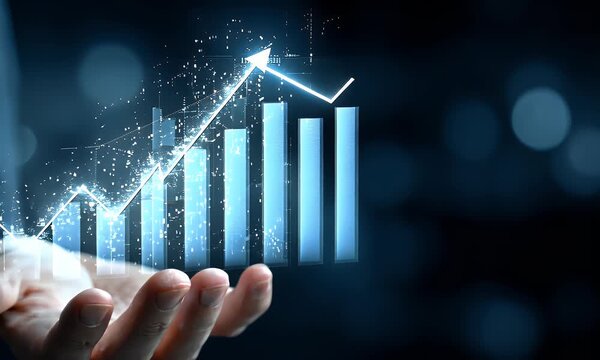 
Hand holding up upward arrows with a business growth graph chart on a blue background for a financial market or online stock trading concept. - Powered by Adobe