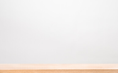 Empty wooden table against gray wall. background for your advertisement presentation