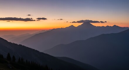 Fototapeta premium Majestic layered mountain range silhouette at dusk with ethereal orange and purple sky backdrop