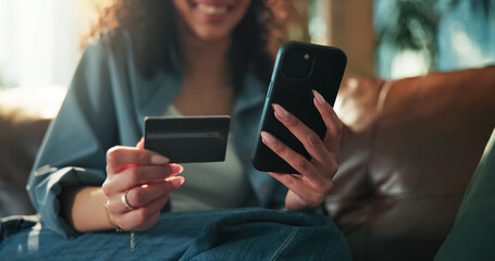 Hands, phone and credit card on sofa with online shopping, sale and easy payment on web in home. Person, smartphone and digital banking on mobile app, fintech or discount deal with ecommerce at house