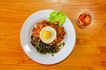 Kimchi fried rice with seaweed and fried egg
