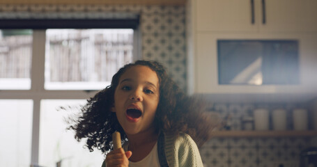 Singing, broom and portrait of child in kitchen for fun, music and happy while cleaning. Home, childhood and girl with energy, karaoke and song for housekeeping, chore routine and hygiene on weekend