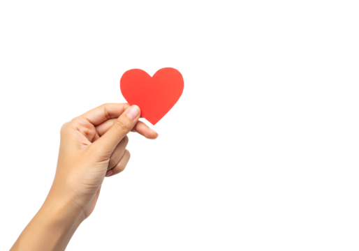 Close-up of a hand holding a red paper heart symbolizing love and compassion against a black - Powered by Adobe
