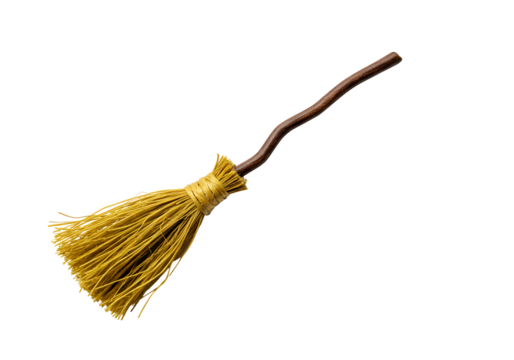 Close-up of a traditional broomstick with natural bristles and curved handle isolated on black