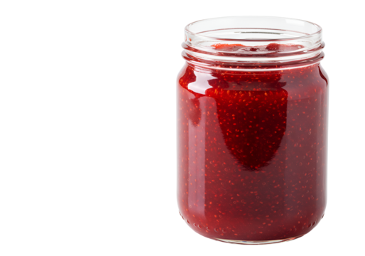 Close-up of fresh strawberry jam inside a clear glass jar with a black background