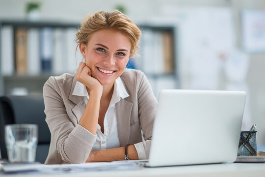 Appealing professional using a laptop in an office Business individuals