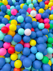 lots of colored balls from a dry pool
