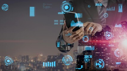 A professional businessman engages with a smartphone while surrounded by digital graphs and data analytics. The modern city skyline creates a vibrant backdrop at night. Xenic - Powered by Adobe