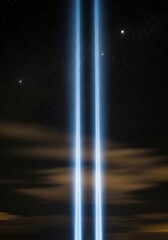 Illuminated tributes reaching into the night sky conveying solemn remembrance and honor