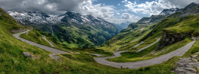 Winding mountain road through lush valleys