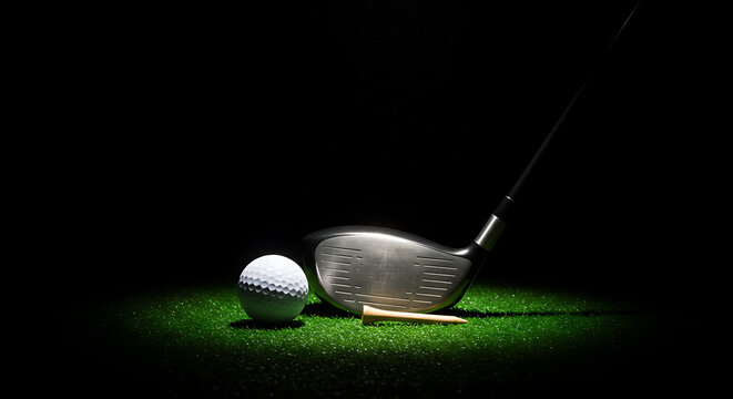 Wood golf club with ball and tee on dark dramatic background — professional golfing concept
