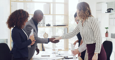 Handshake, finance deal and business people in office with partnership, greeting or welcome. Meeting, agreement and financial advisors shaking hands with client for investment contract in workplace.