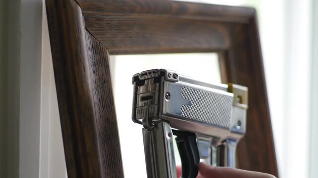 Staple Gun on Wooden Frame for Carpentry Work
