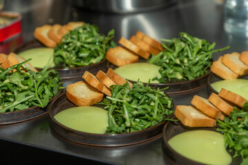 Bread arugula salad and avocado dressing