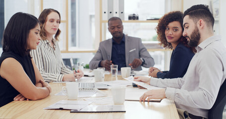 Paperwork, business people and team meeting in office for financial insurance, strategy or graphs. Group, document or planning with manager for risk management, policy analysis and conversation