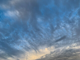 Blue sky with streaky clouds. Cloudscape background.