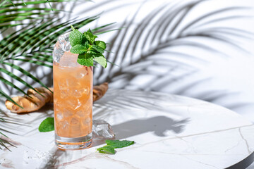 Salty ginger-ade non-alcoholic cocktail drink with lemon juice, dates, salt, cumin, ginger beer and mint