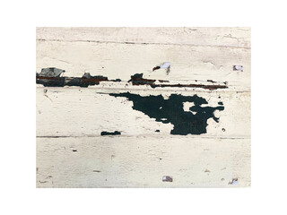 White wooden wall with peeling paint revealing green layer underneath