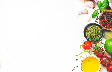 Healthy food background with spices, herbs, turmeric, dried herbs, chili powder and kitchen utensils, white table, copy space, top view