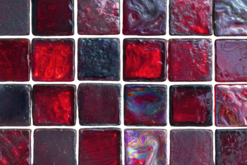 Abstract, vibrant, red, and dark-gray mosaic tiles