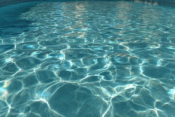 Rippled teal pool water reflecting sunlight