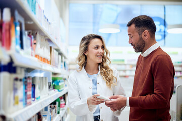 Pharmacist Assisting Customer in Choosing Product at Pharmacy Store