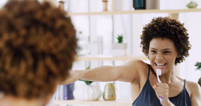 Brushing teeth, mirror and singing with woman in bathroom of home for energy, fun or hygiene. Cleaning, reflection and toothbrush with African person in apartment for dental results or satisfaction