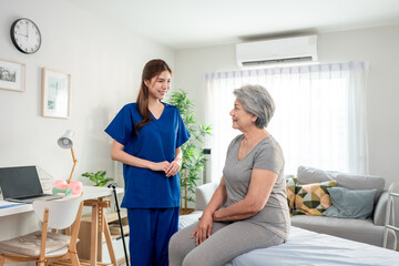 Obraz premium Asian beautiful caregiver examine senior woman patient at nursing home. 