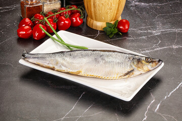 Whole raw salted herring fish