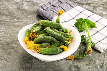 Raw gherkin cucumbers in the bowl