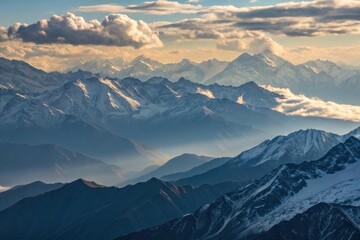 aerial view of snow mountains and cloudy sky