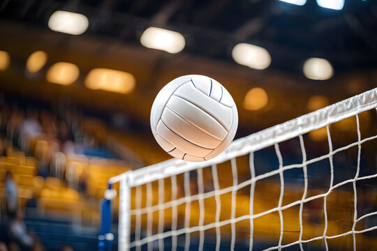 White volleyball in motion over net with blurred stadium background sport game